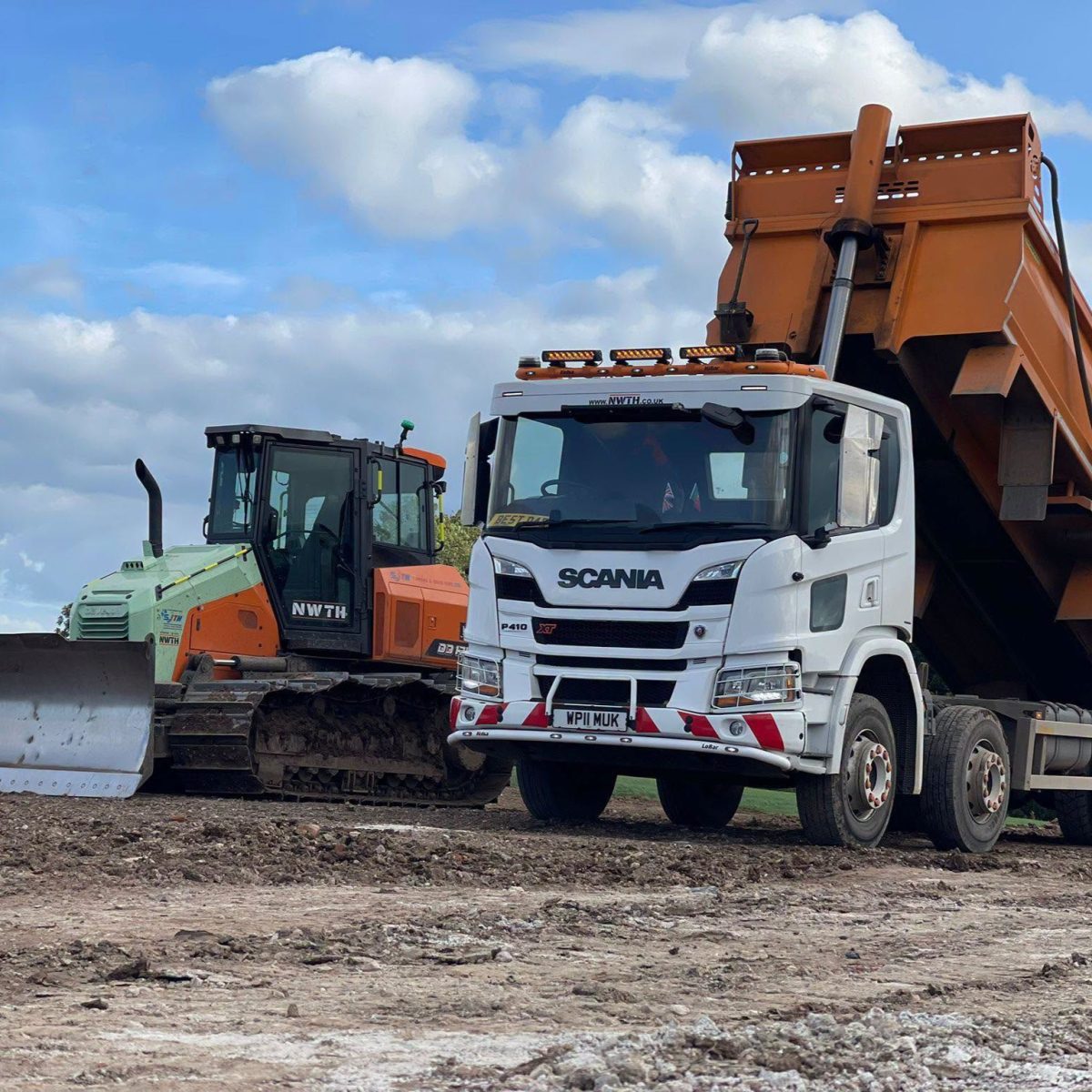 plant vehicles ready to conduct muck away services in Cheshire